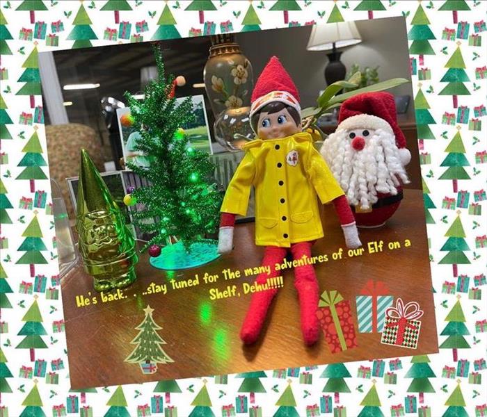 Photo of our elf on the shelf named Dehu with text overlay stating he